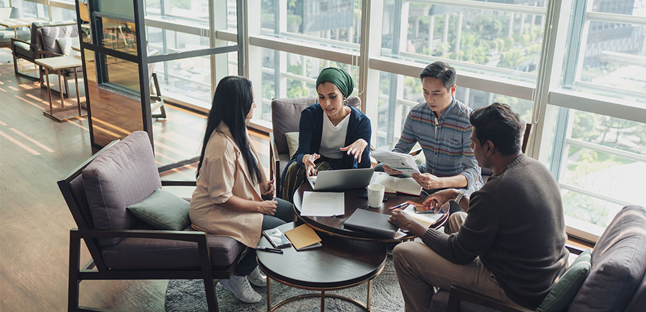 A group of employees in Singapore having a meeting